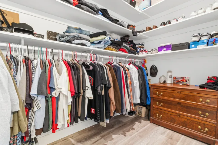 Walk in closet featuring light wood-style flooring