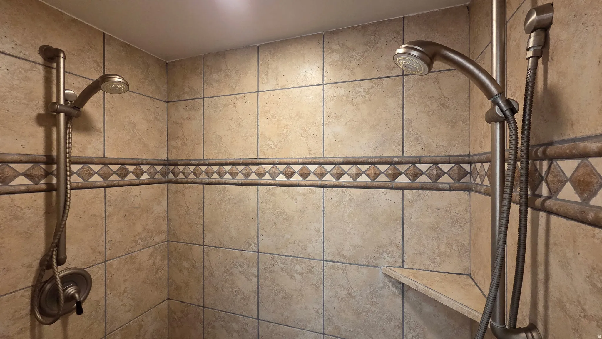 Bathroom view of a tile shower