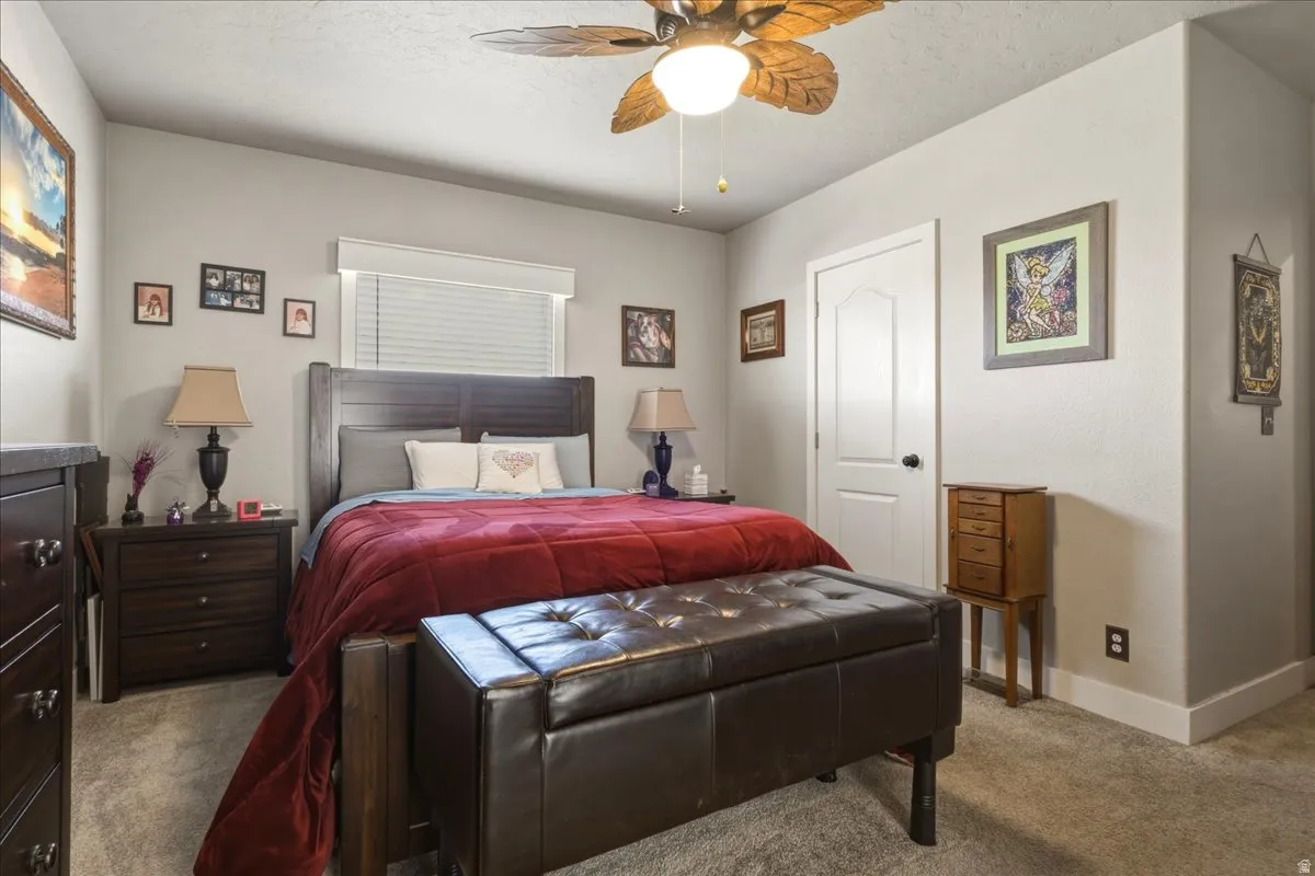 Bedroom featuring carpet flooring and ceiling fan