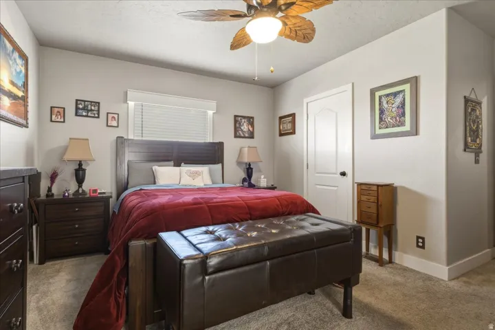 Bedroom featuring carpet flooring and ceiling fan