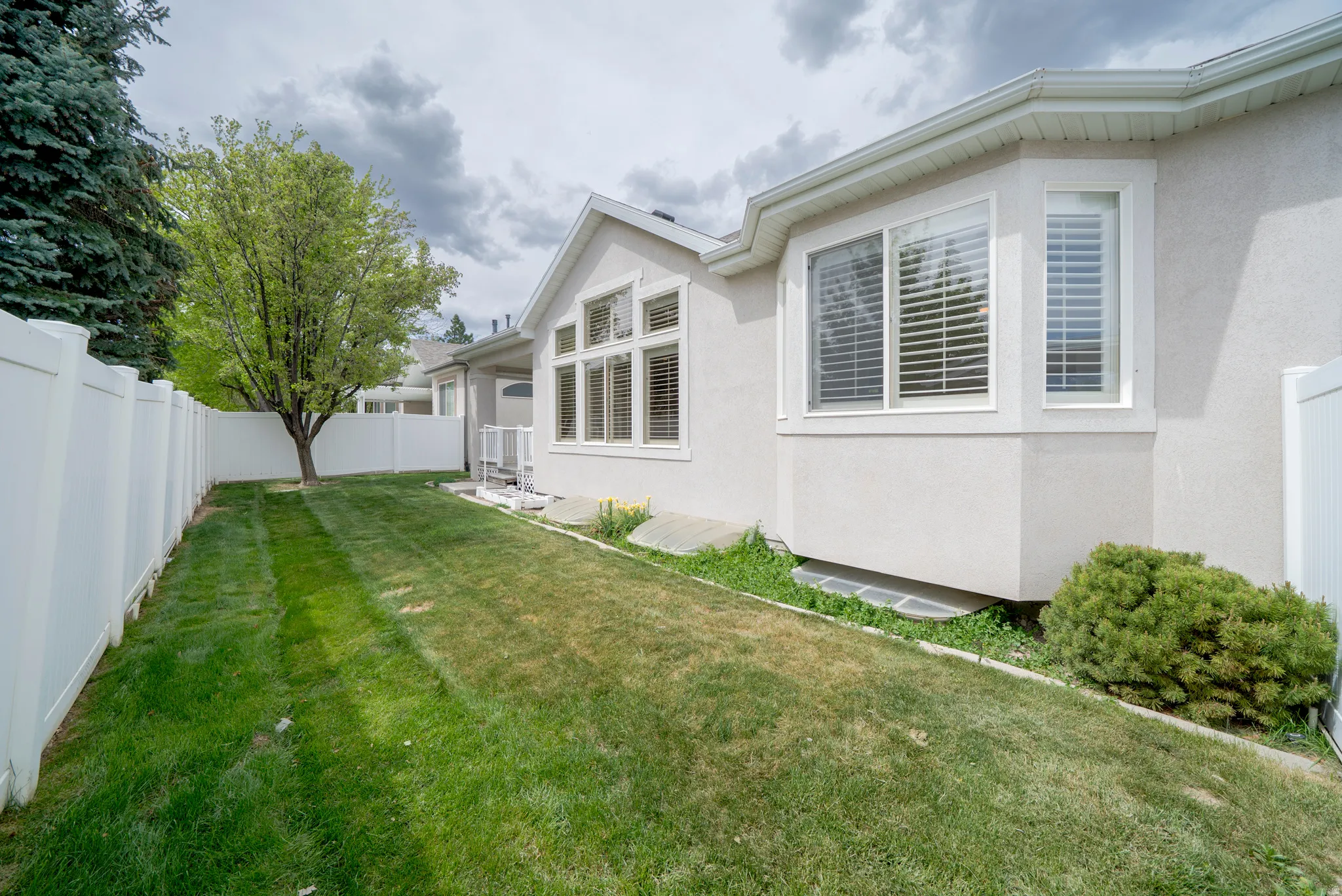 View of fenced backyard