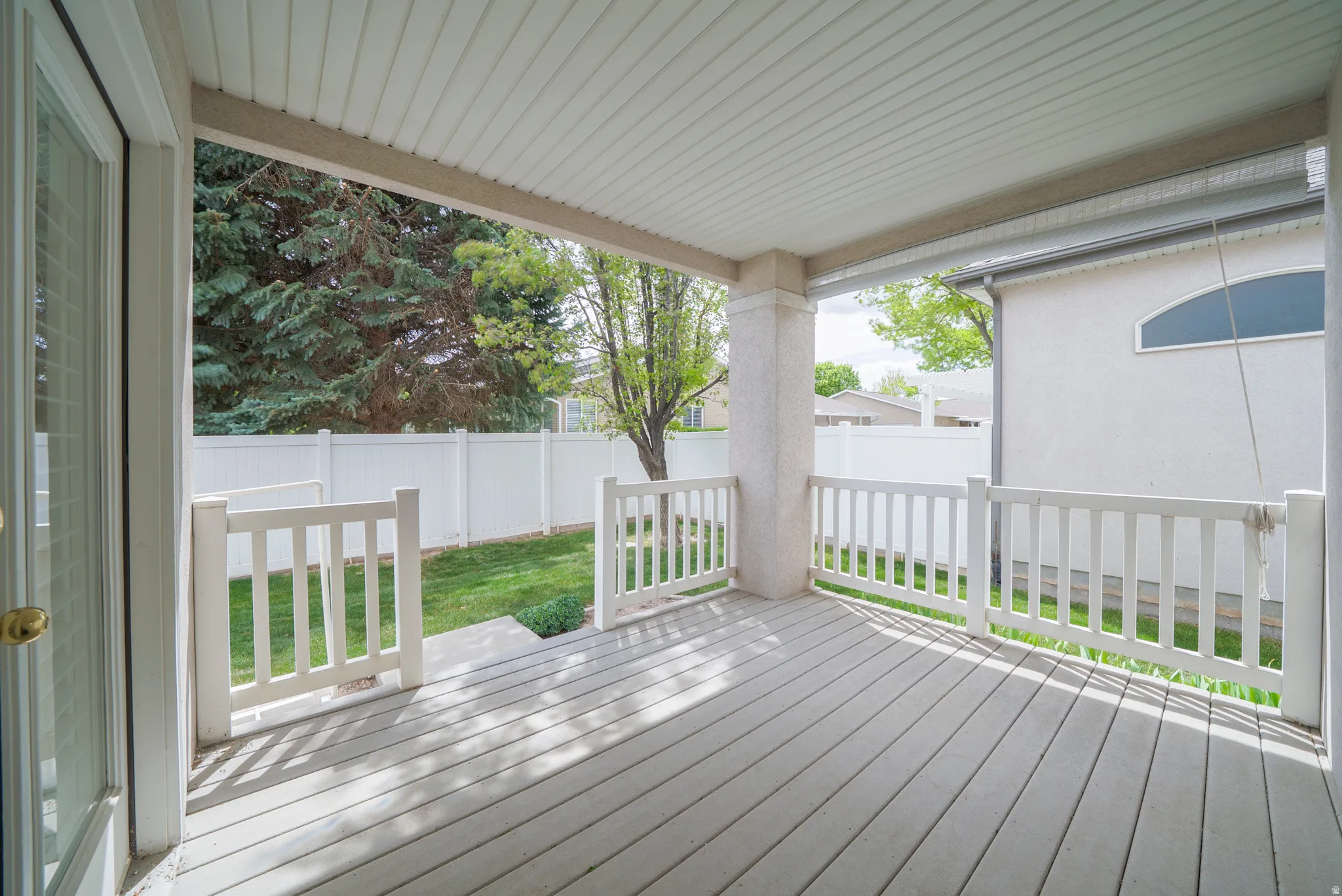 Wooden deck featuring a fenced backyard