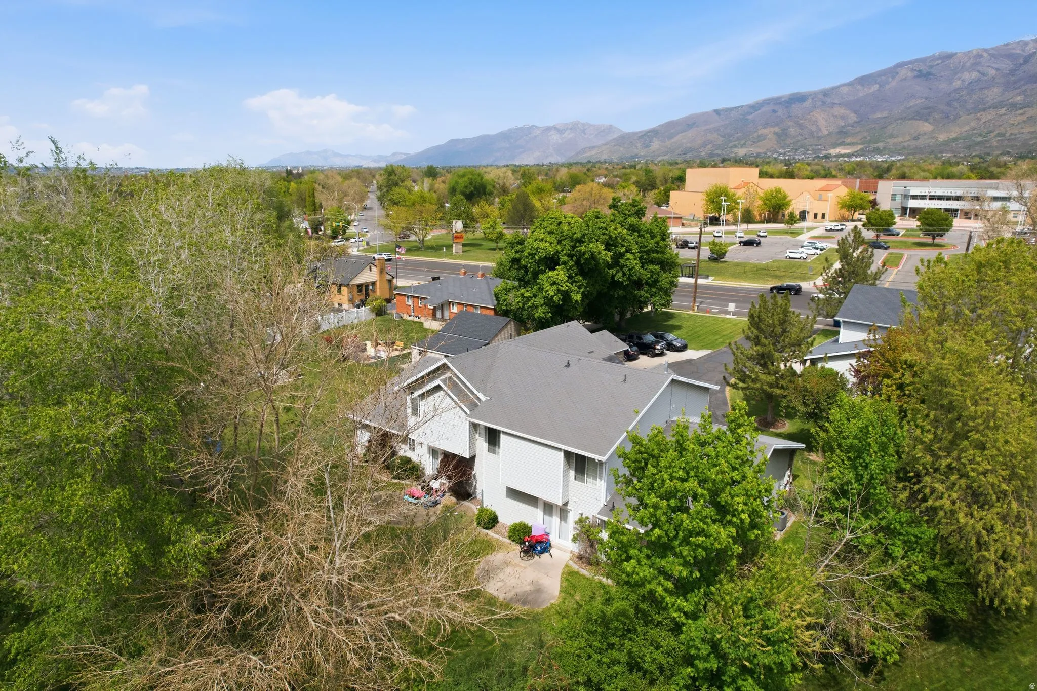 Aerial view of residential area featuring mountains
