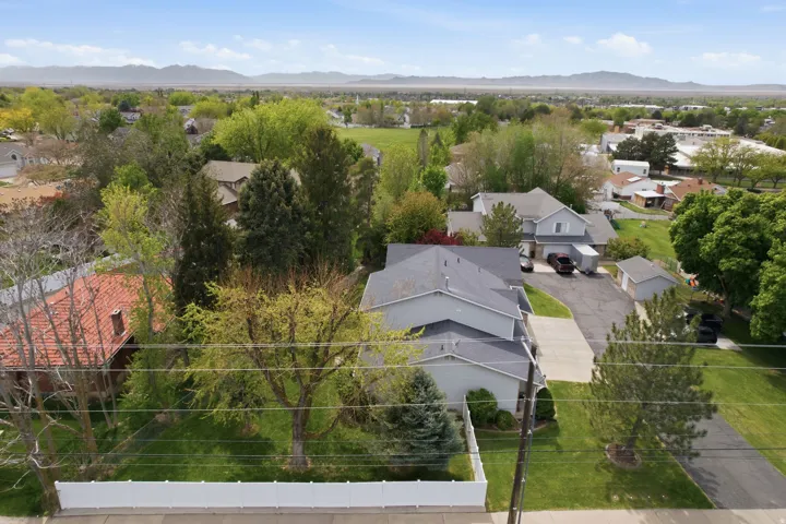 Aerial perspective of suburban area featuring a mountainous background