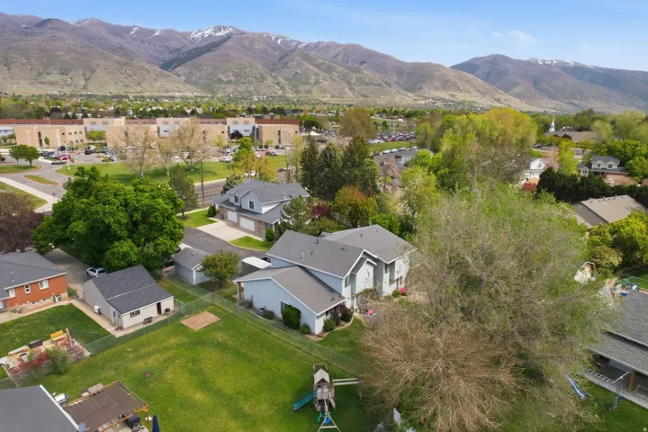 Aerial view of residential area featuring a mountain backdrop