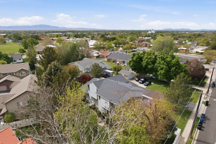 Aerial view of residential area featuring mountains