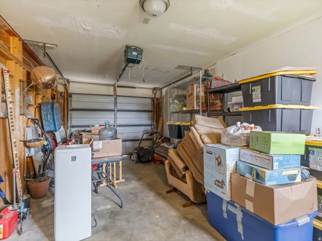 Garage featuring a garage door opener