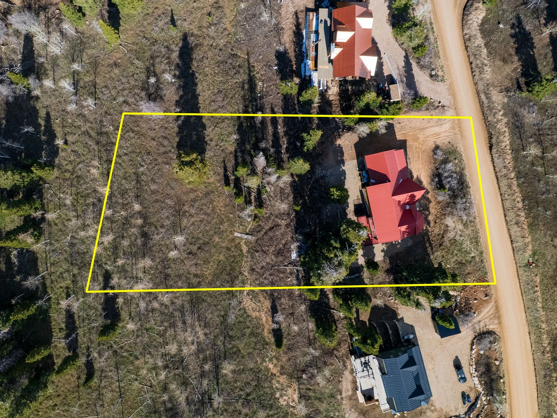 Aerial view of property and surrounding area with property boundaries highlighted