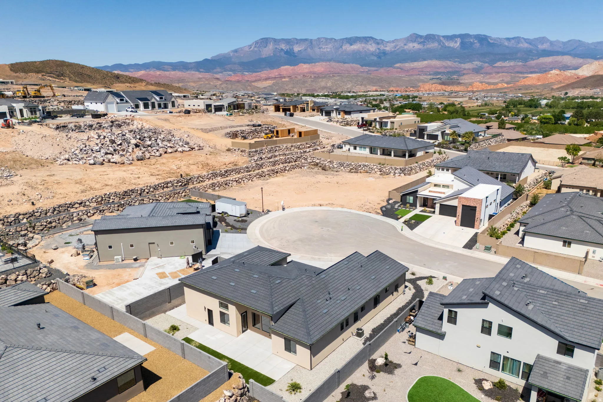 Aerial perspective of suburban area featuring a mountainous background