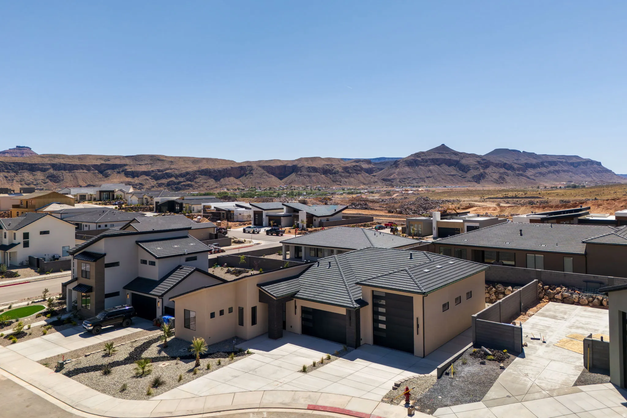 Aerial perspective of suburban area with a mountainous background