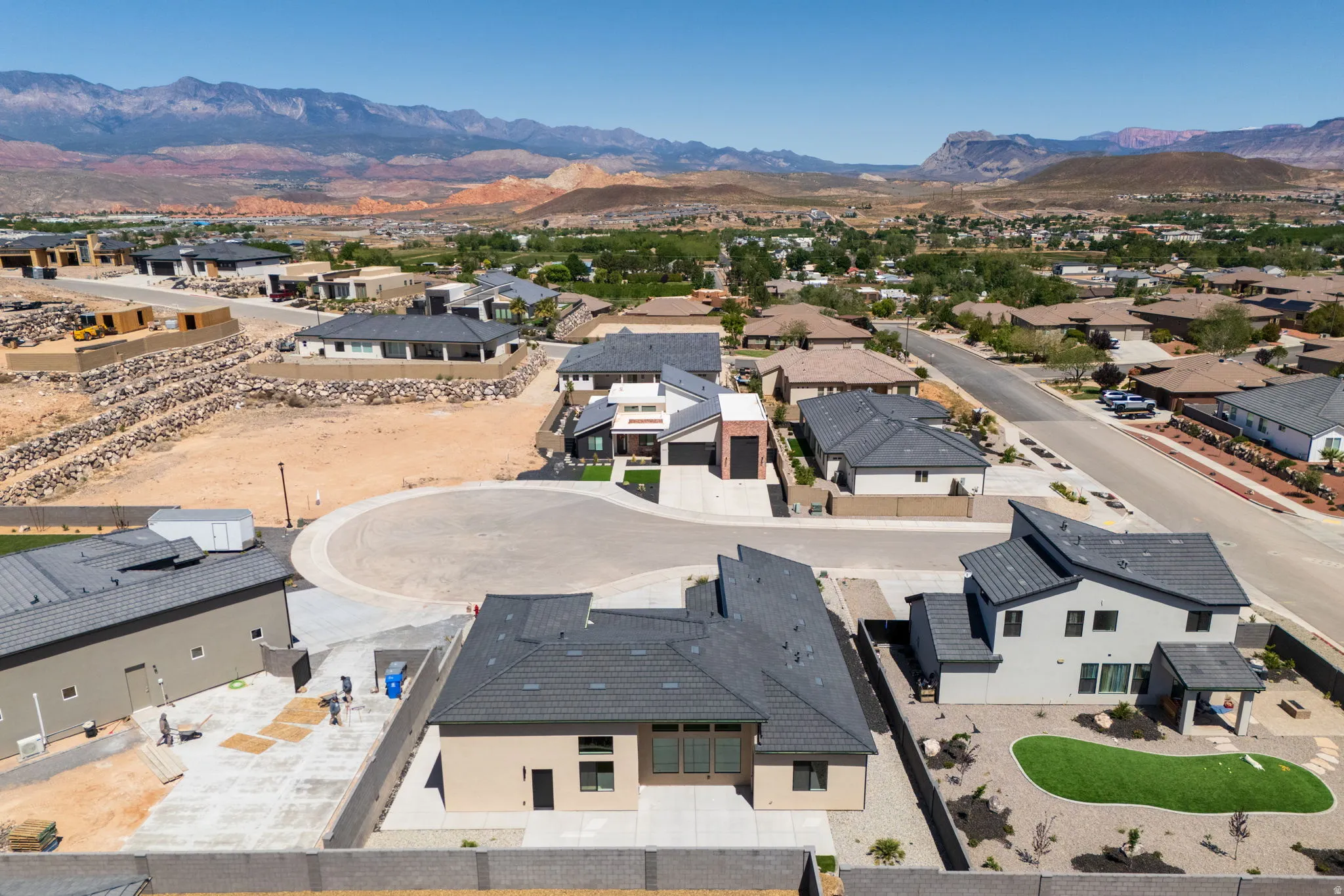 Aerial perspective of suburban area featuring a mountainous background