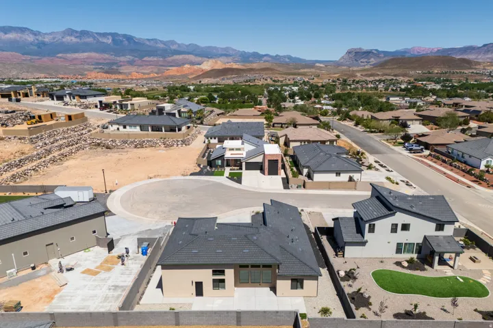 Aerial perspective of suburban area featuring a mountainous background