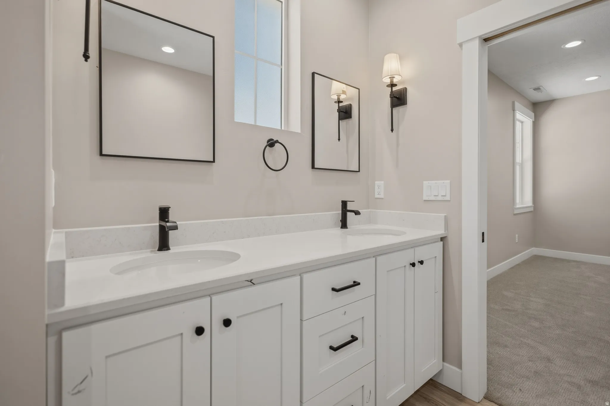 Full bath featuring double vanity and recessed lighting