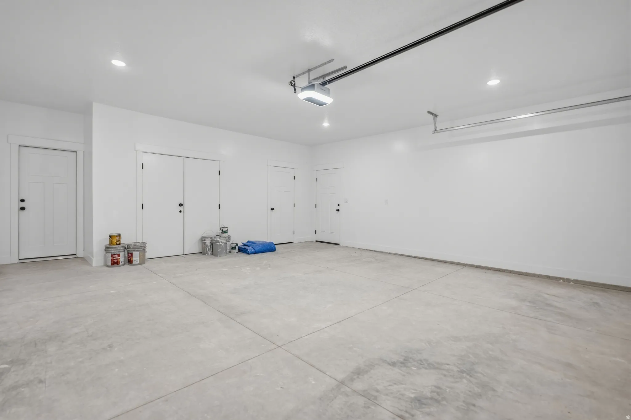 Garage featuring recessed lighting and a garage door opener