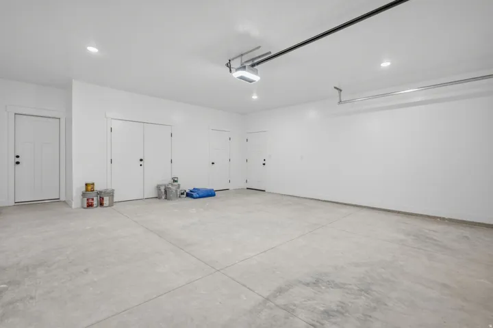 Garage featuring recessed lighting and a garage door opener