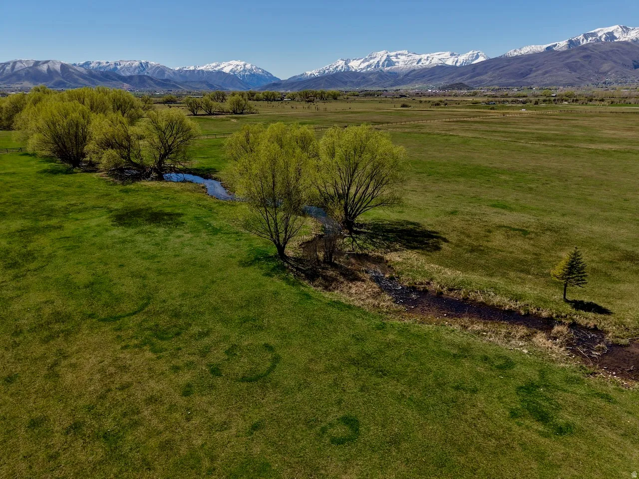 View of mountain backdrop featuring rural landscape and a pastoral area