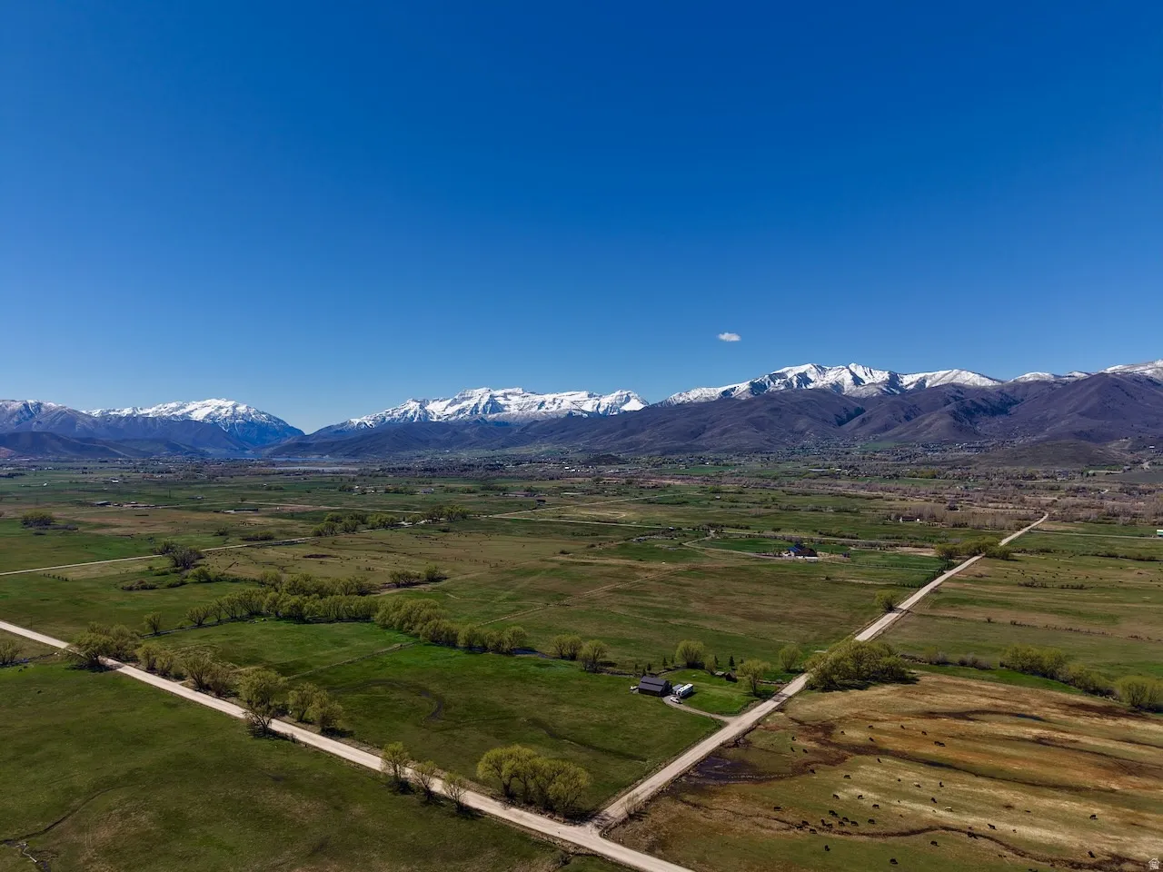 View of mountain background featuring rural landscape and agricultural land