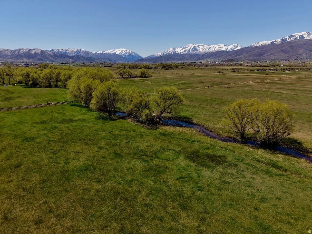 View of mountain background featuring rural landscape and agricultural land
