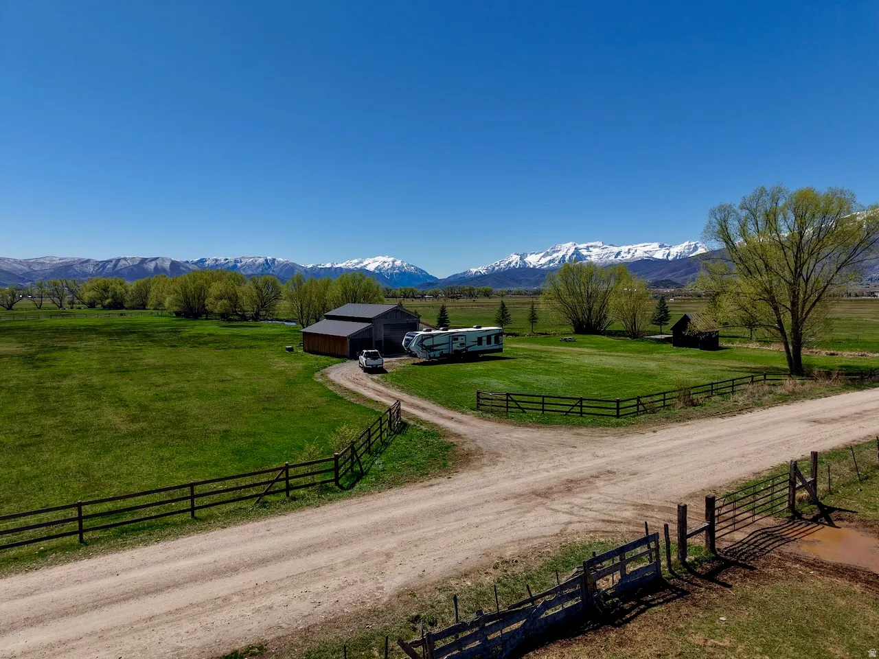 View of mountain backdrop featuring rural landscape and agricultural land