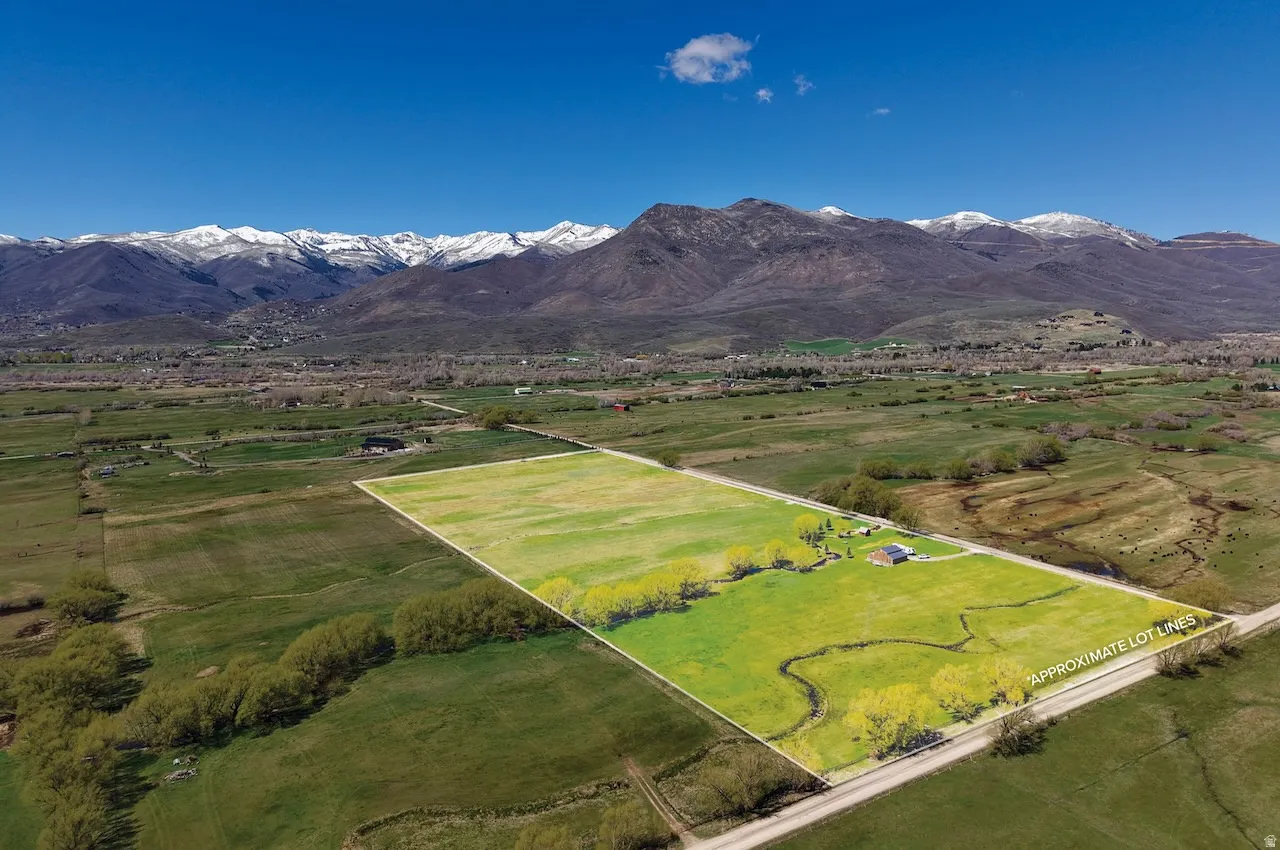 Aerial view of sparsely populated area featuring a mountainous background