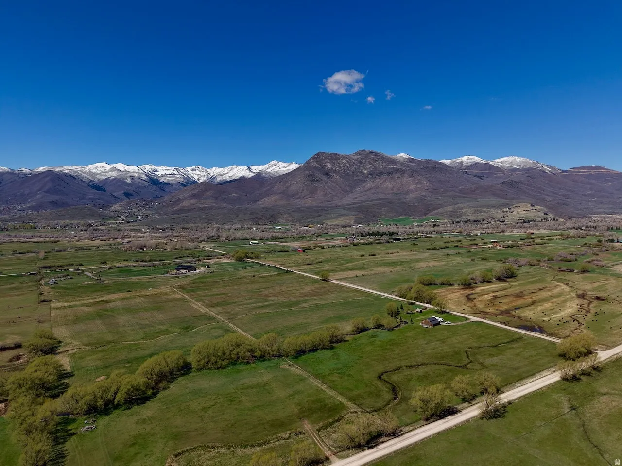 Overview of rural landscape with a mountain backdrop