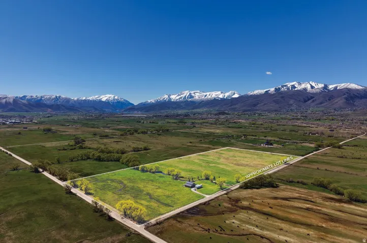 Aerial view of sparsely populated area featuring a mountainous background