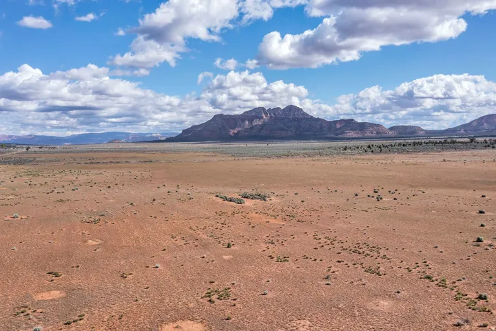 View of mountain backdrop featuring a desert landscape and rural landscape