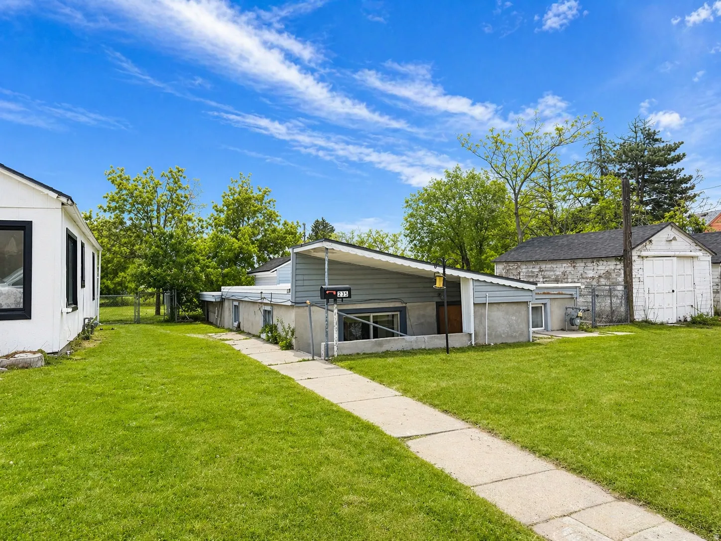 View of home's exterior with an outdoor structure
