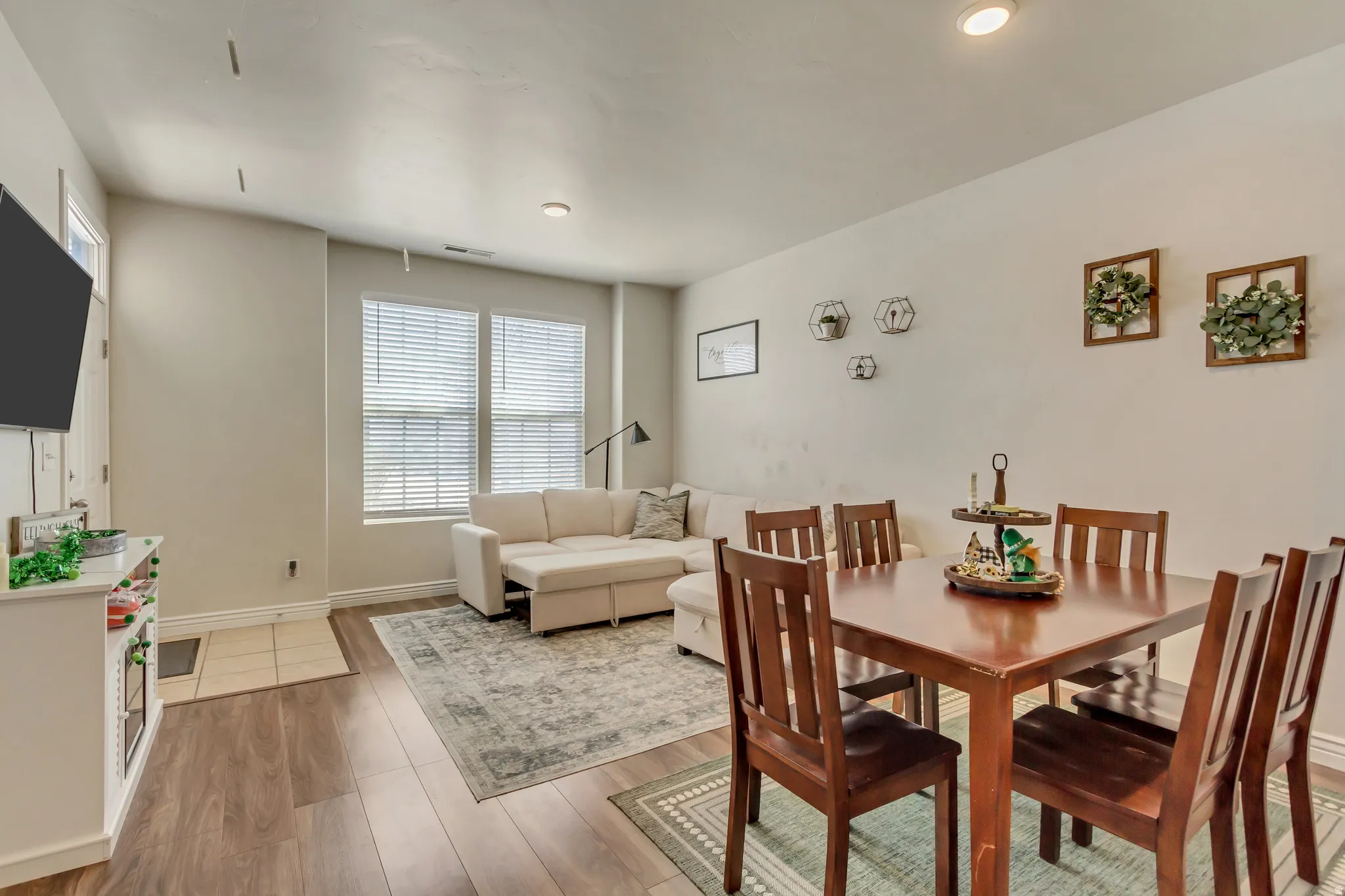 Dining area with light wood-style flooring and baseboards