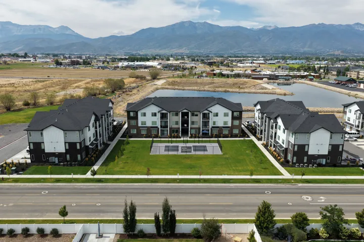 Aerial perspective of suburban area with a water and mountain view