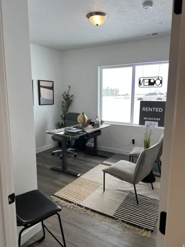 Office/Bedroom with wood finished floors
