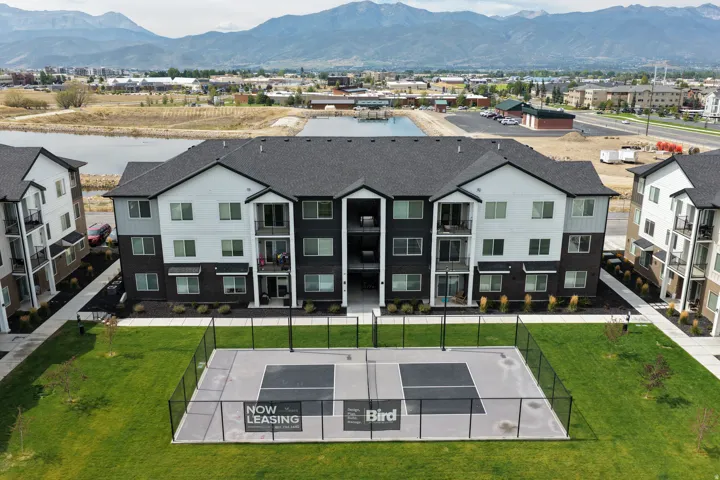Aerial view of residential area featuring a mountain backdrop