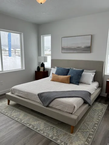 Master bedroom featuring wood finished floors