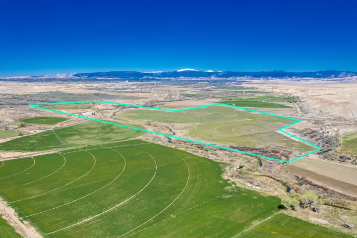 View of rural area with property parcel outlined and mountains