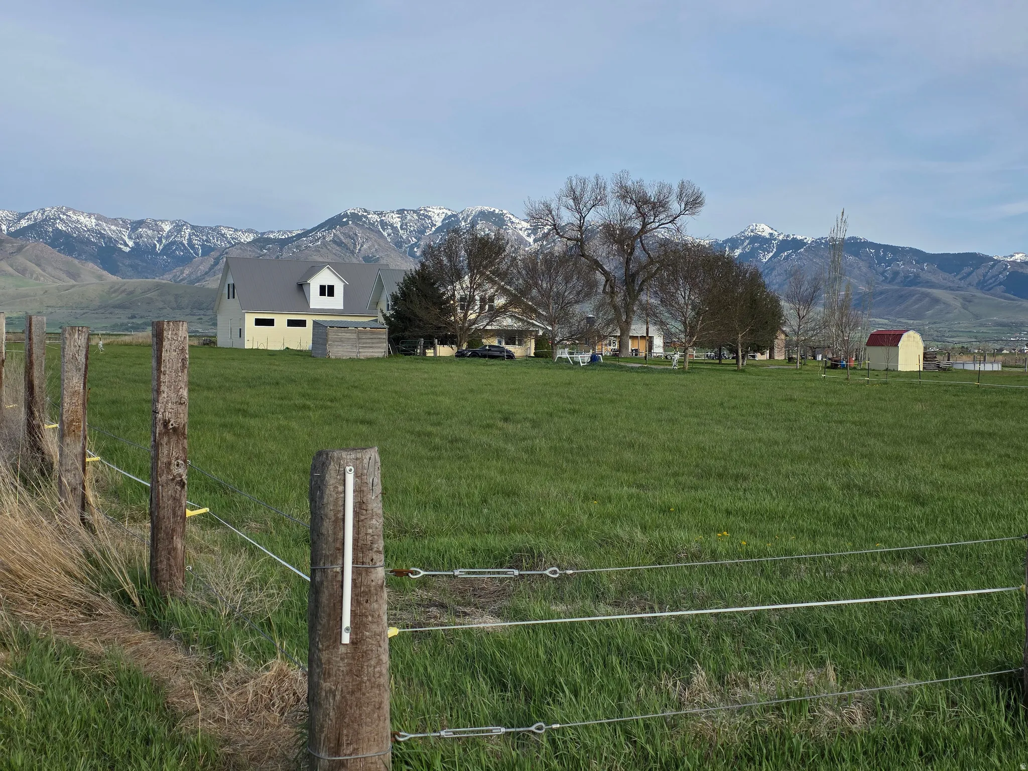 View of yard featuring a mountain view, a view of rural / pastoral area, and an outdoor structure