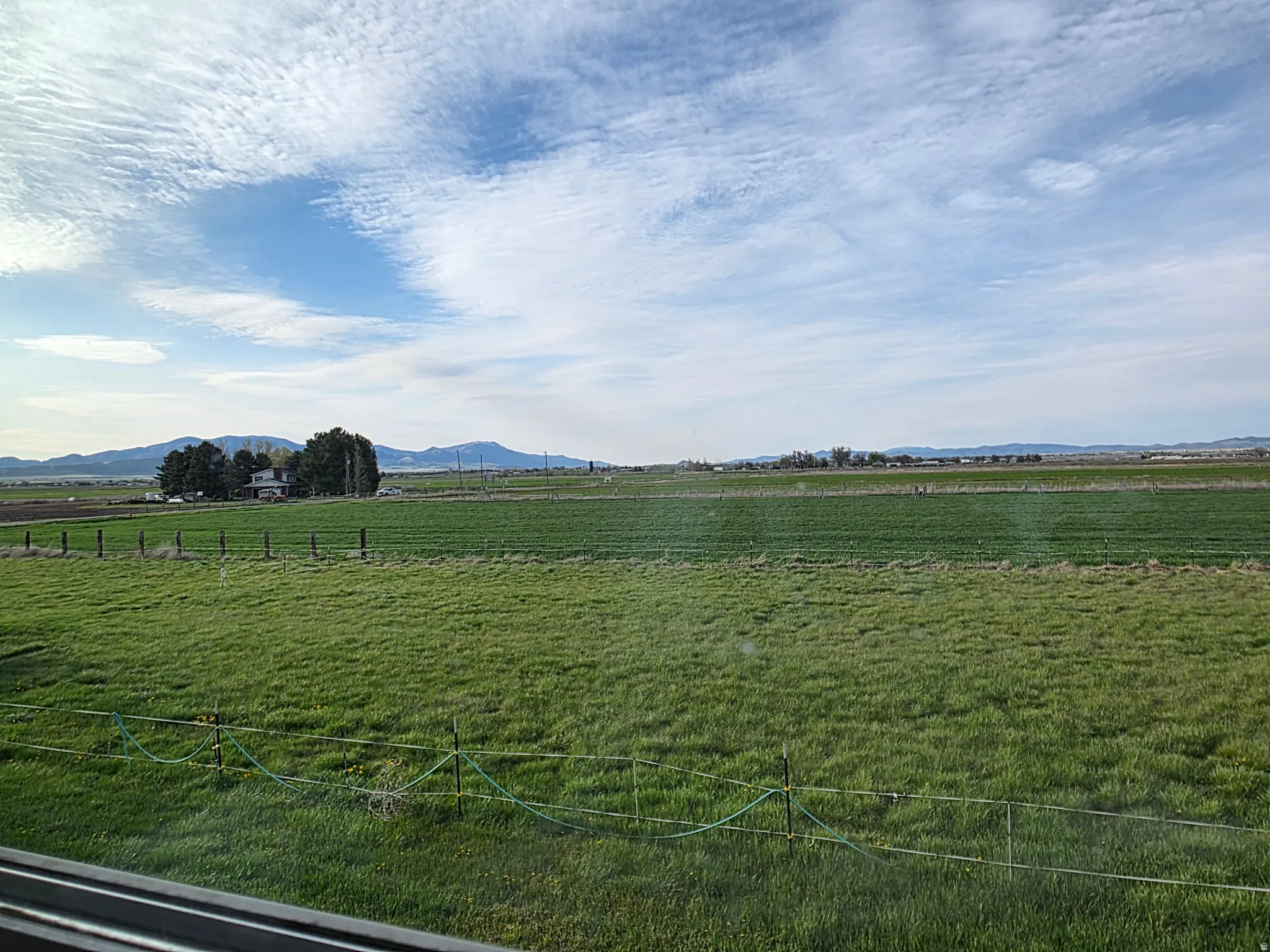 View of yard featuring a rural view and a mountain view