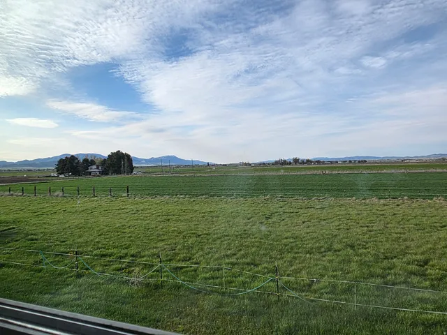 View of yard featuring a rural view and a mountain view