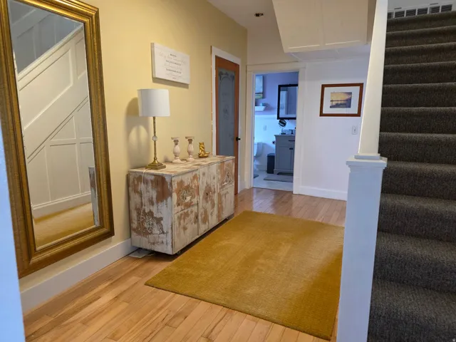 Hall featuring light wood-style flooring
