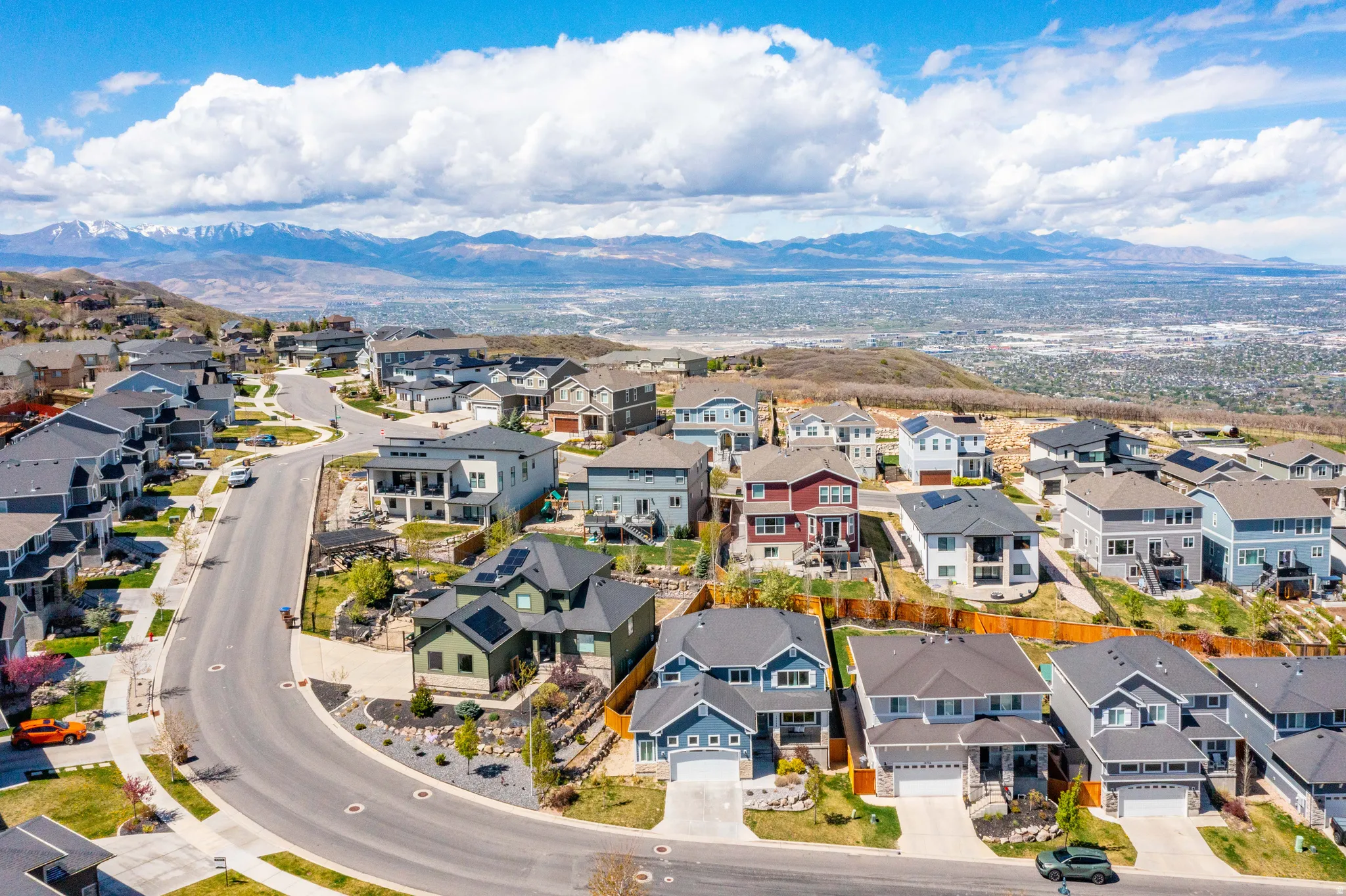 Aerial view of residential area featuring a mountain backdrop