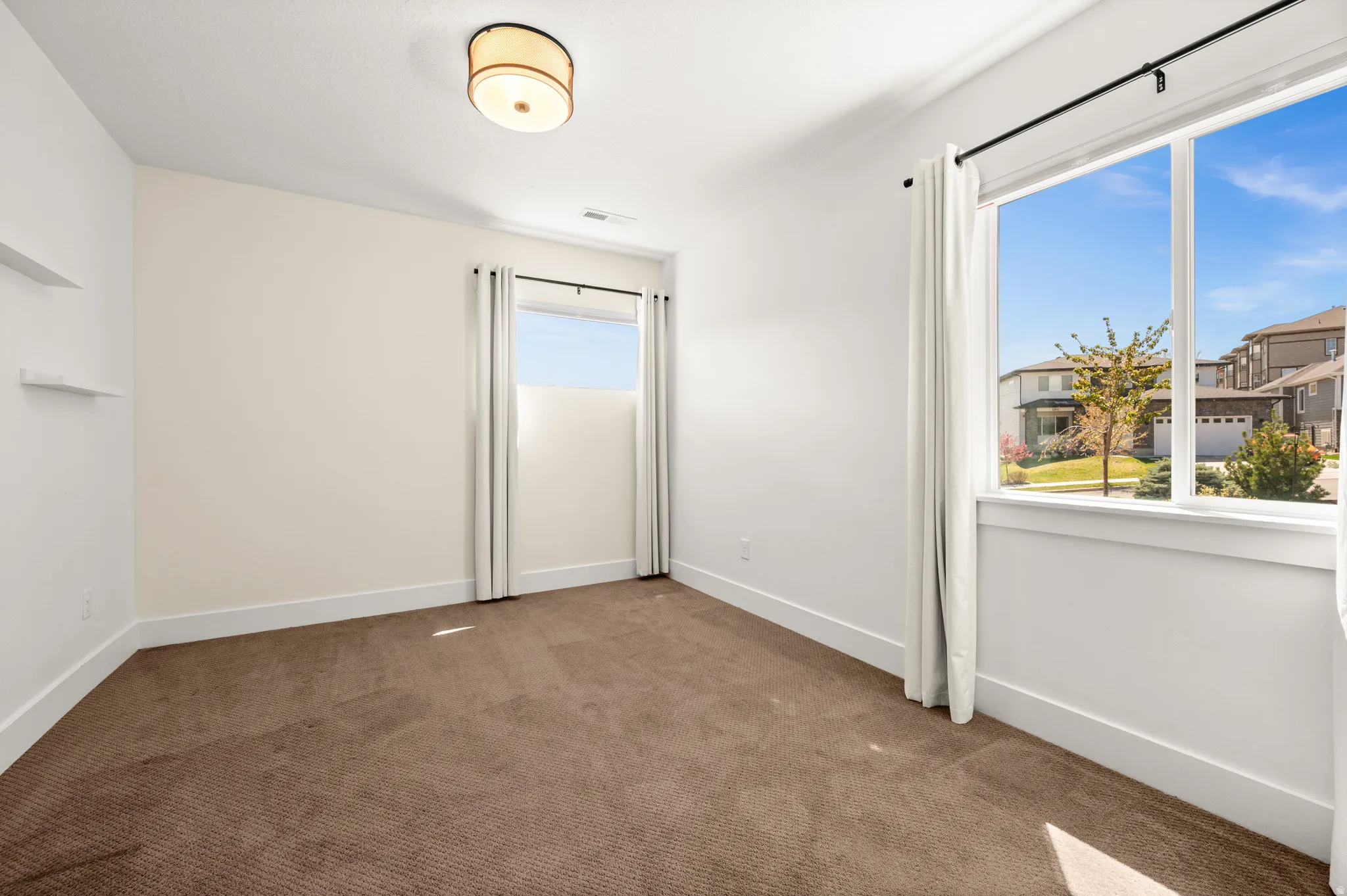 Empty room with baseboards and carpet floors