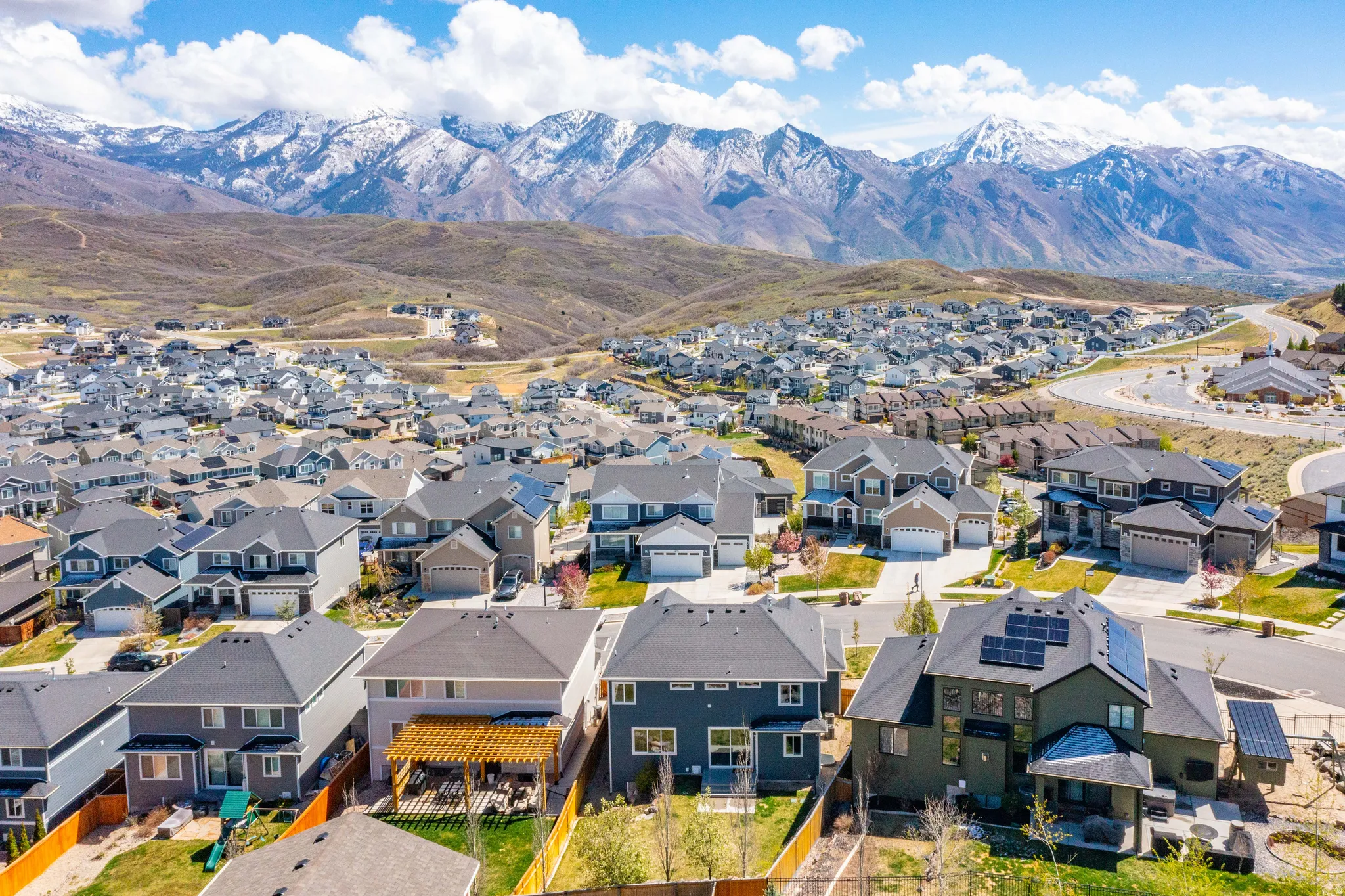 Aerial view of residential area featuring a mountain backdrop