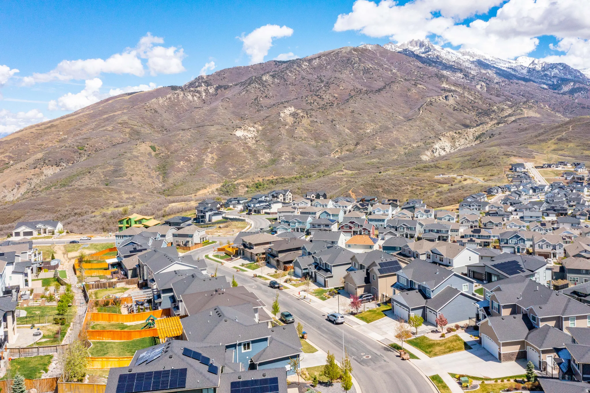 Aerial perspective of suburban area with a mountain backdrop