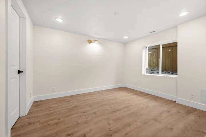 Unfurnished room featuring light wood-style floors and recessed lighting