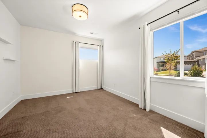 Empty room with baseboards and carpet floors