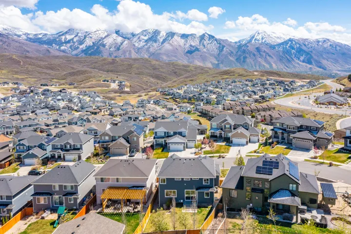 Aerial view of residential area featuring a mountain backdrop