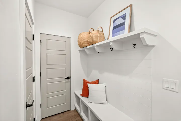 Mudroom with dark wood-style floors