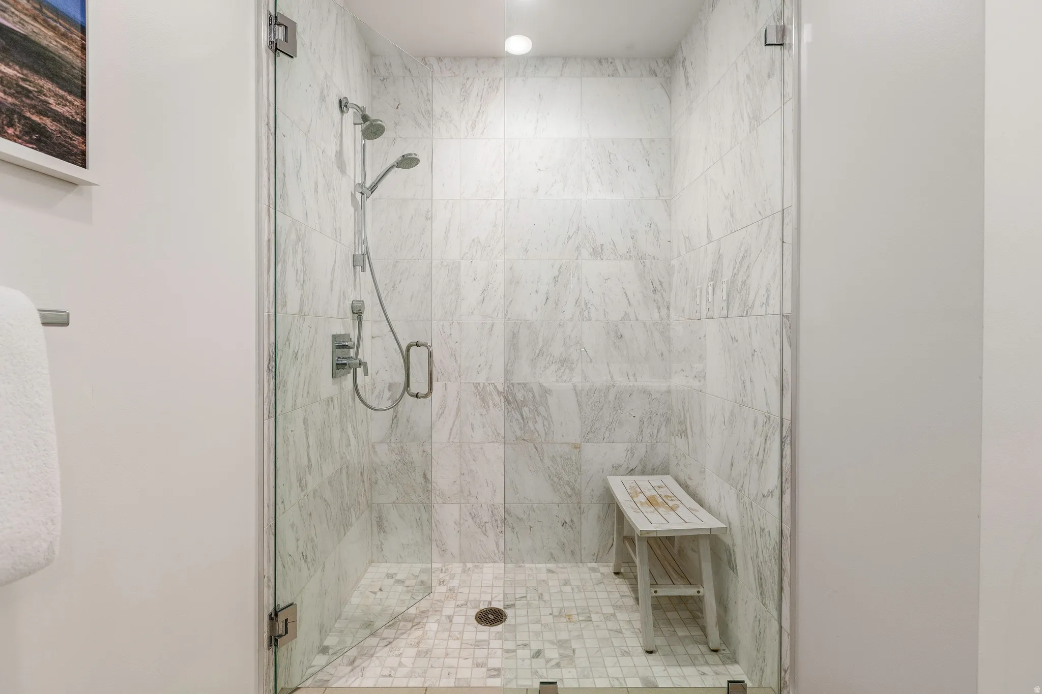 Full bathroom featuring a shower stall