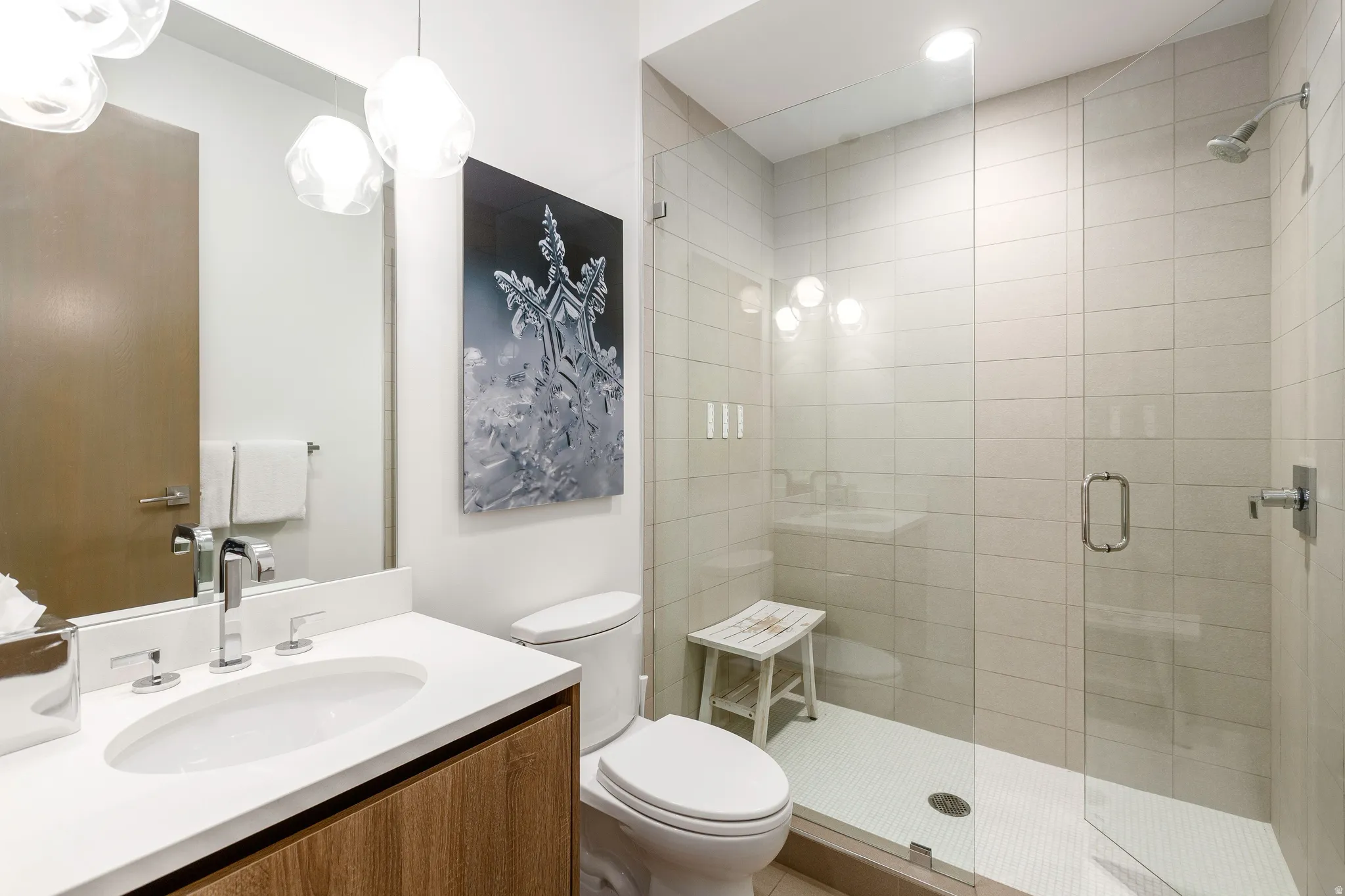 Full bathroom featuring vanity and a shower stall