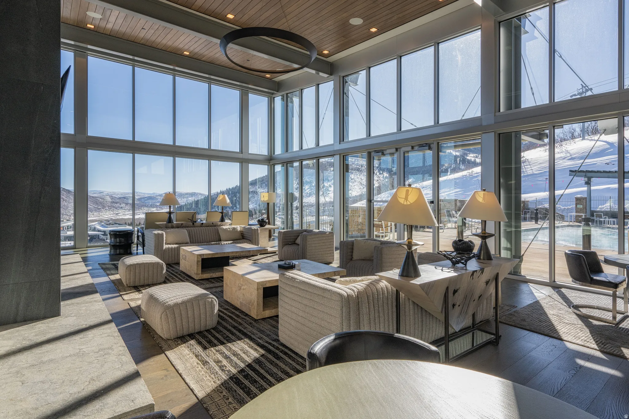Common area featuring a mountain view, a high wooden ceiling, and floor to ceiling windows