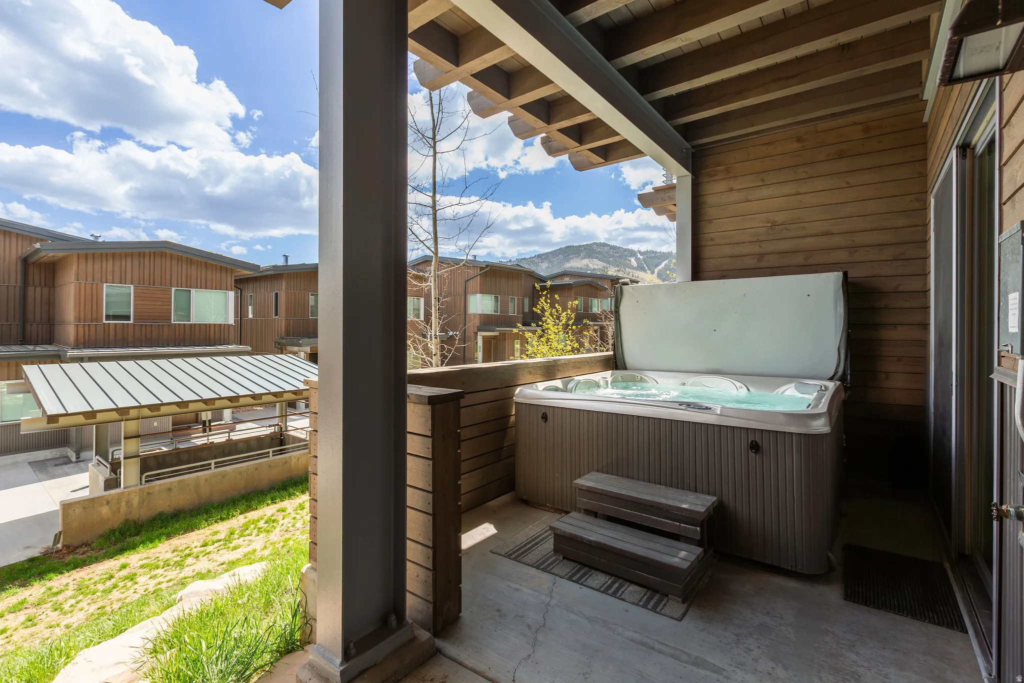View of patio / terrace with a hot tub